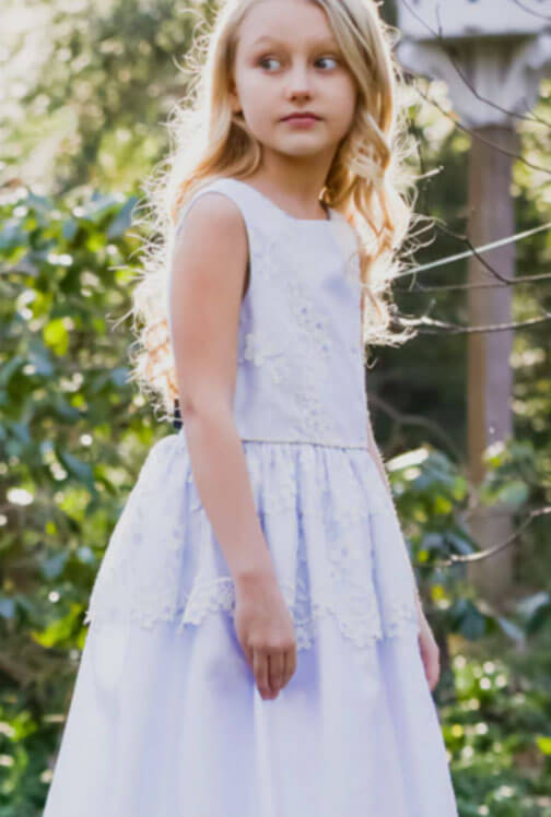 Flower girl in a light purple dress