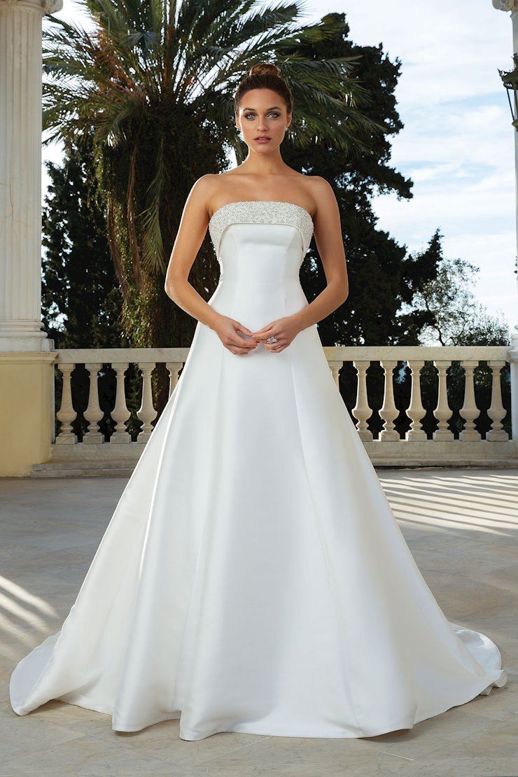 Model wearing a Justin Alexander dress